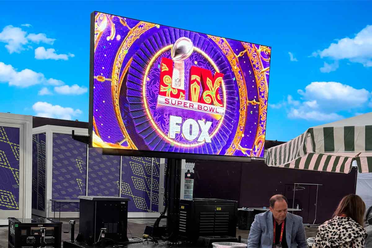 Mobile LED trailer screen displaying live sports broadcast